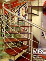 Winding metallic Stairs. Stages from red wood.