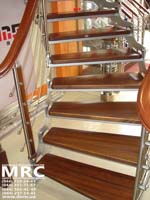 Curved metall Stair. Handrailings and stages from the hard sorts of tree 