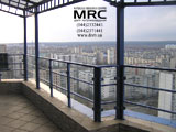 Balcony rail, glass fittings on the 24 stage ( black metall with a powder coating , safe tempered rchitectural glass )